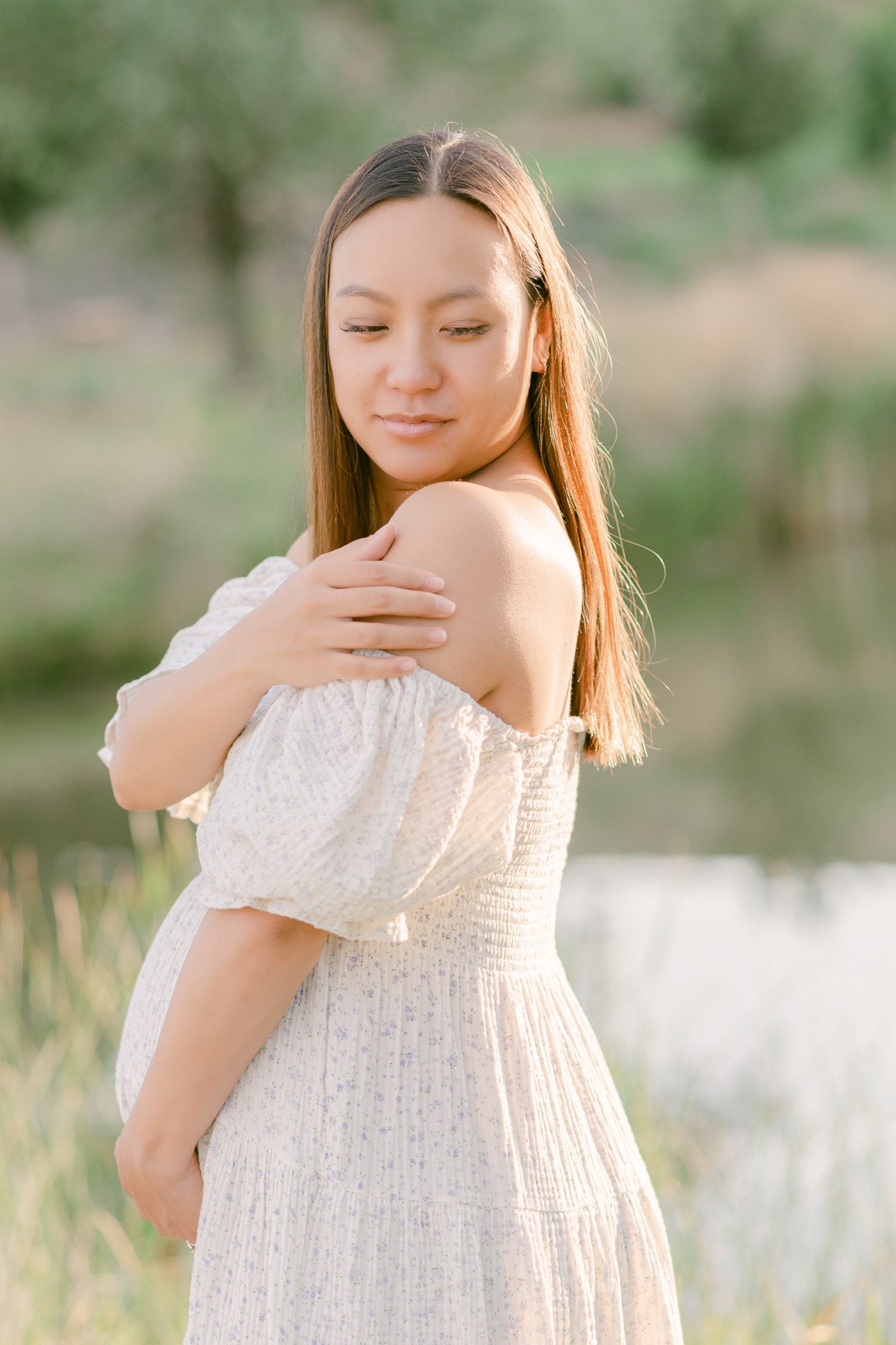 Picture of expecting mom wearing a Nothing Fits But dress during a sunrise session in Longmont Colorado taken by Olive and Aster Photography
