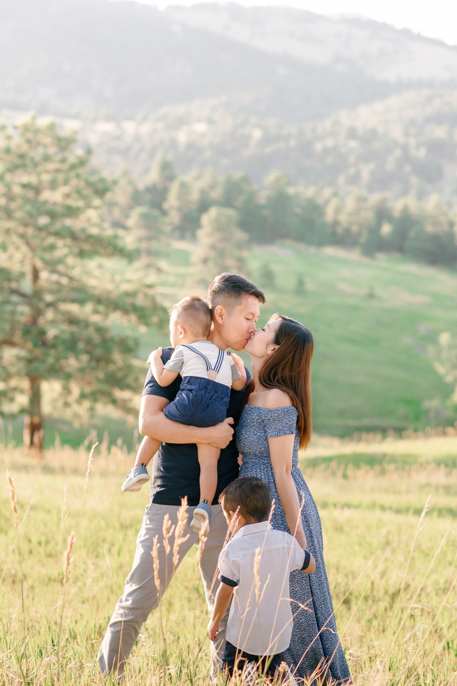 Golden hour family portrait session taken by Olive and Aster based in Colorado with mountains in the background