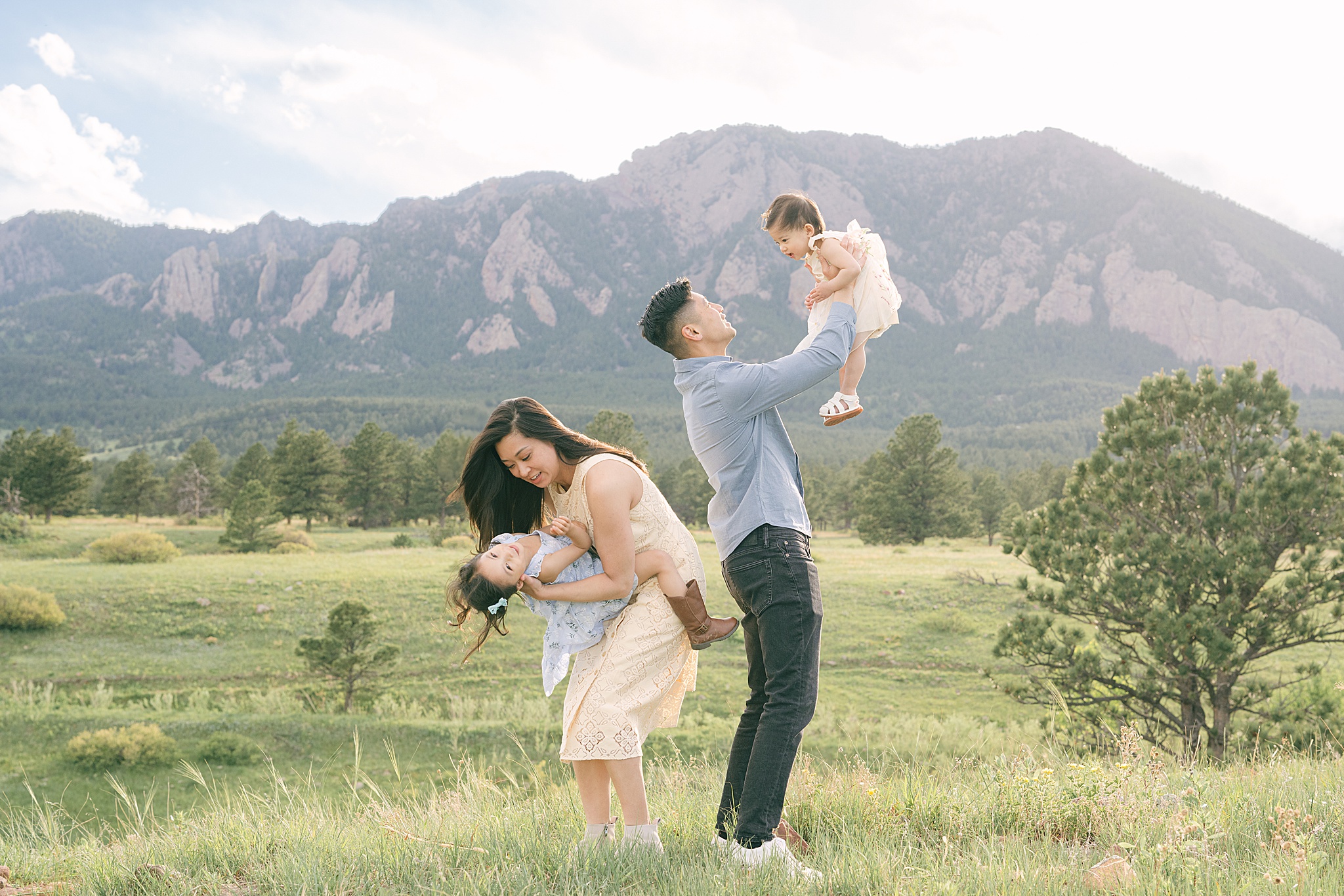 Two parents from Denver planning with their daughters during a family photoshop in Boulder, CO