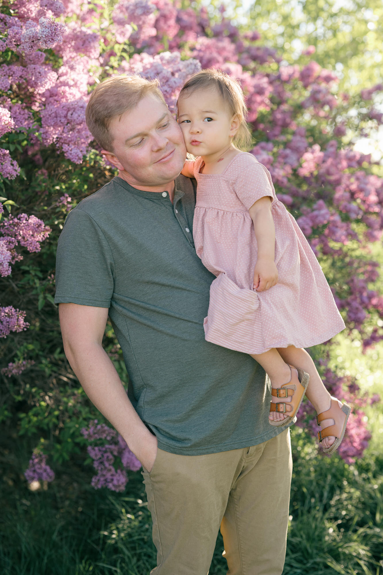 Spring Family Photos in Denver of a dad and his daughter with lilacs in the background