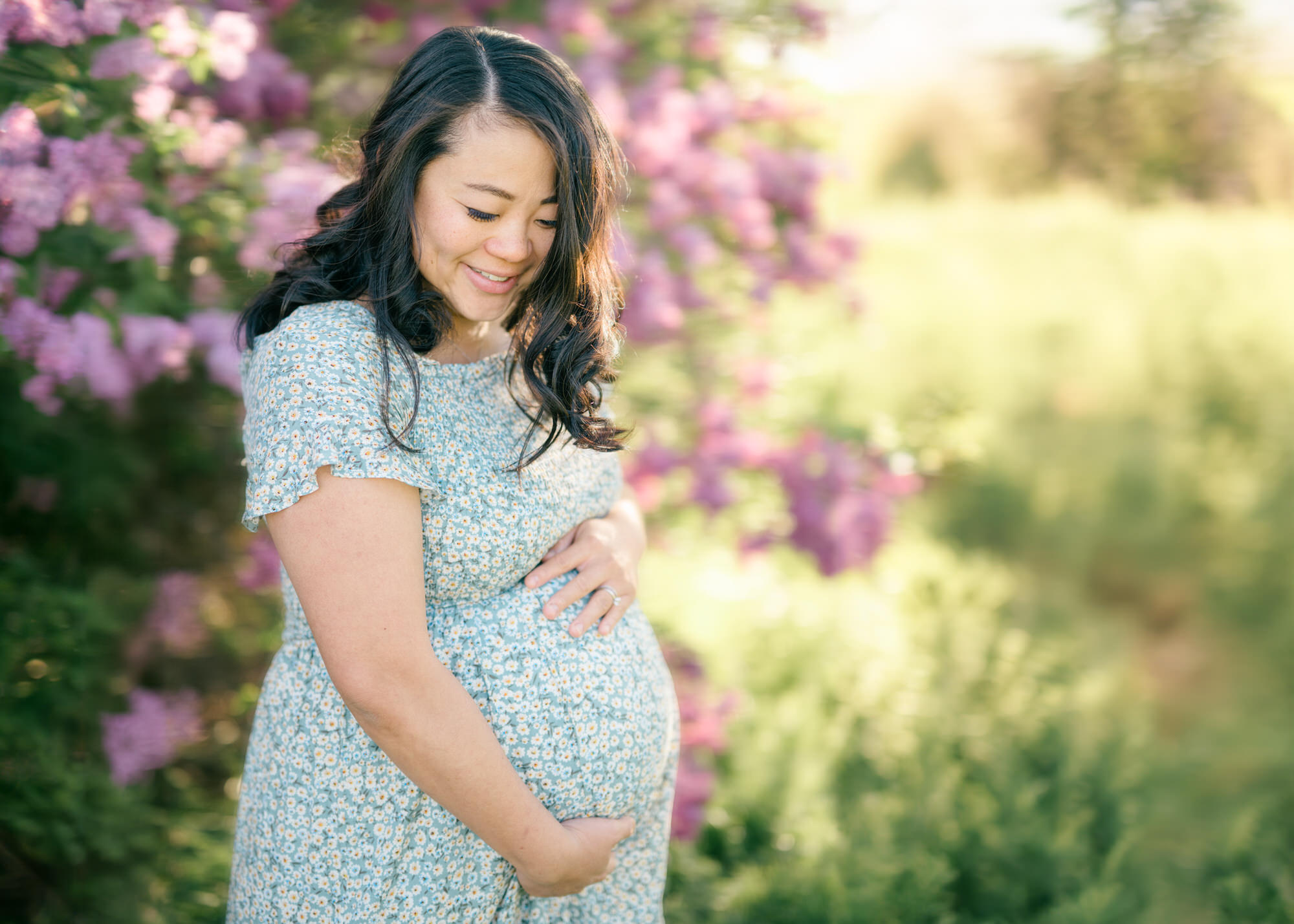 Spring Maternity Photos in Denver with lilacs in the background