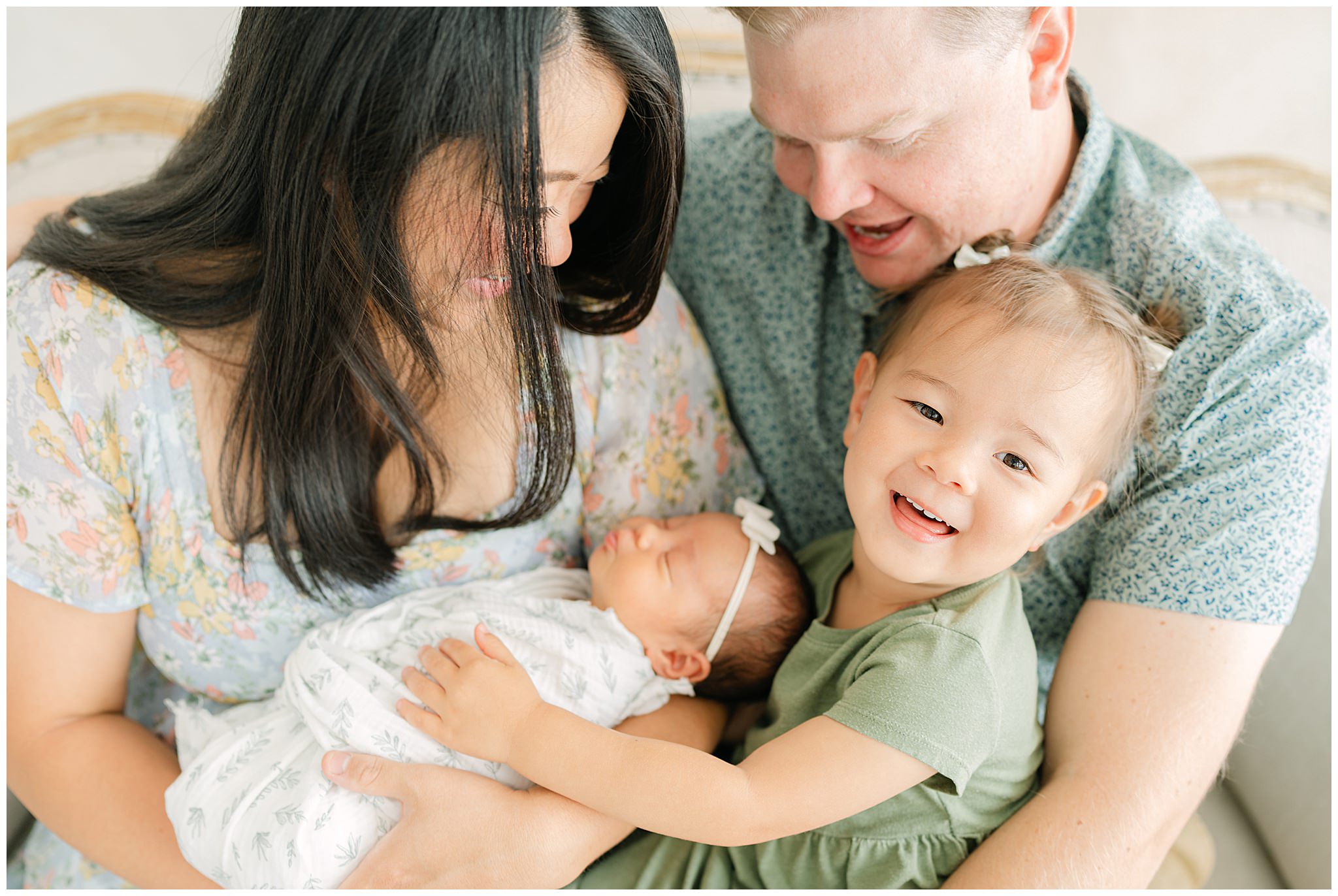 A photo a Colorado family during a newborn photoshoot taken by Denver Newborn Photographer Olive and Aster at little white photo studio Frederick Colorado
